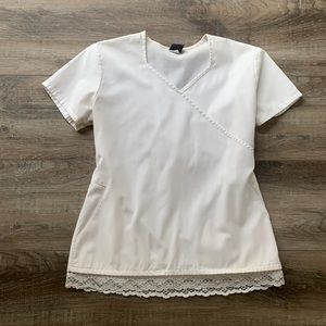 White scrub top with lace trim